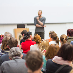 Image showing Man giving presentation in lecture hall at university.