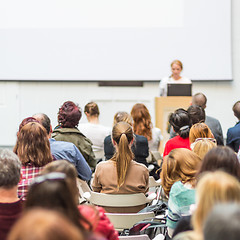 Image showing Woman giving presentation in lecture hall at university.