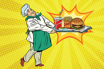 Image showing The chef brings a tray of fast food