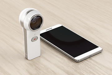 Image showing 360 degree camera and smartphone