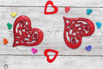 Image showing Symbolic hearts on red background
