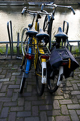Image showing bicycles by canal amsterdam