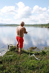 Image showing Angler by a lake