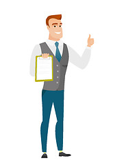 Image showing Businessman with clipboard giving thumb up.