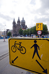 Image showing sign amsterdam bicycle side and pedestrain side of street