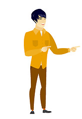 Image showing Young asian businessman pointing to the side.