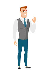 Image showing Smiling businessman showing ok sign.