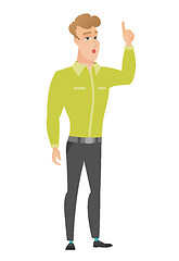 Image showing Businessman with open mouth pointing finger up.