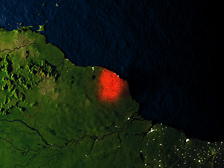 Image showing French Guiana in red from space at night