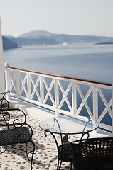 Image showing table with chairs patio oia ia santorini caldera