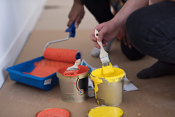 Image showing painters prepare color for painting