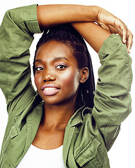 Image showing young pretty african-american girl posing cheerful emotional on white background isolated, lifestyle people concept 