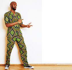 Image showing portrait of young handsome african man wearing bright green nati