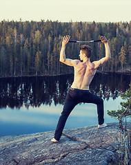 Image showing middle age man doing sport yoga on the top of the mountain, lifestyle people outdoor, summer wild nature for training 