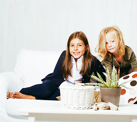 Image showing two cute sisters at home playing, little girl in house interior 