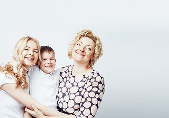 Image showing happy smiling family together posing cheerful on white background, lifestyle people concept, mother with son and teenage daughter isolated 