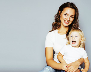 Image showing mother with daughter together in bed smiling, happy family close