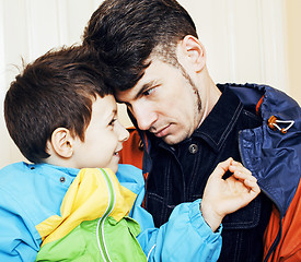 Image showing Young father hipster and his little son outside. Talking, teachi