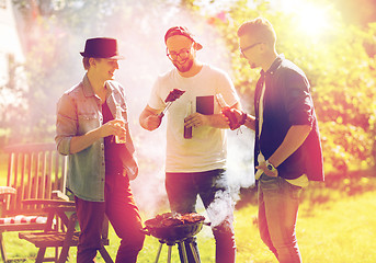 Image showing friends drinking beer at summer barbecue party