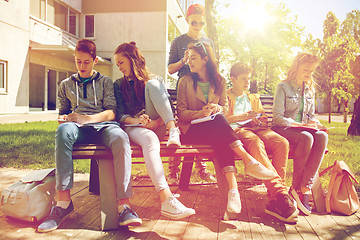 Image showing group of students with notebooks at school yard