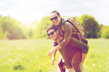 Image showing happy couple with backpacks having fun outdoors