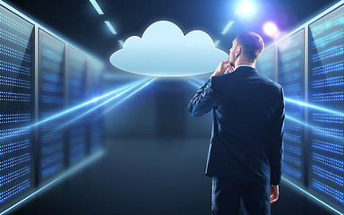 Image showing businessman looking at virtual cloud hologram