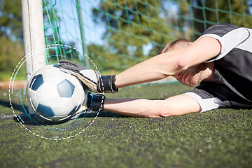 Image showing goalkeeper with ball at football goal on field