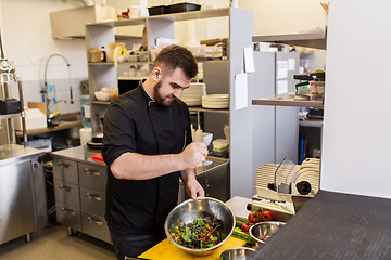 Image showing chef cook making food at restaurant kitchen