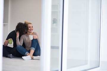 Image showing young couple in their new home