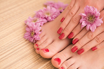 Image showing female feet and hands at spa salon