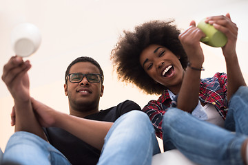 Image showing couple having break during moving to new house