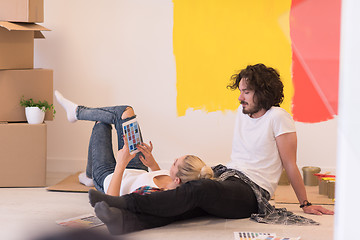 Image showing Happy young couple relaxing after painting