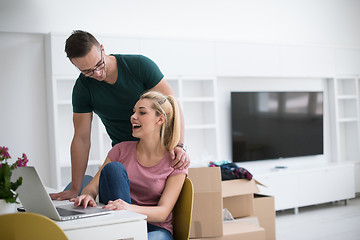 Image showing Young couple moving in a new home