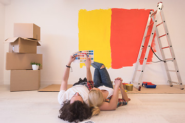 Image showing Happy young couple relaxing after painting