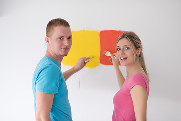 Image showing couple painting interior wall