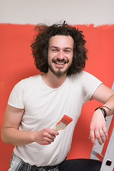 Image showing man with funny hair over color background with brush