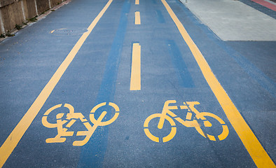 Image showing Bicycle signs painted on asphalt