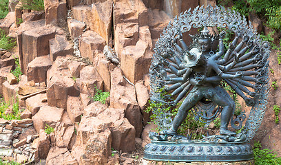 Image showing Tantric Deities statue in Ritual Embrace located in a mountain g