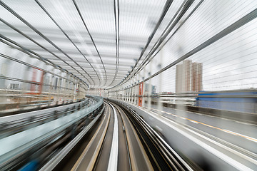 Image showing Subway tunnel with Motion blur of a city 