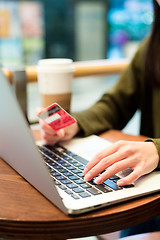 Image showing Woman use of credit card for online payment