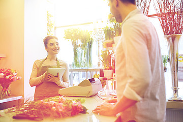 Image showing florist woman and man making order at flower shop