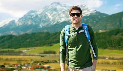 Image showing happy man with backpack traveling in highlands