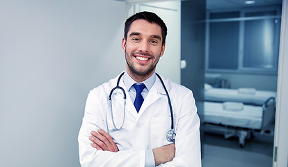 Image showing smiling doctor with stethoscope at hospital 