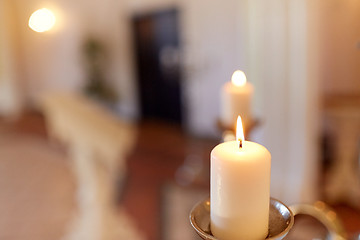 Image showing candles burning in church