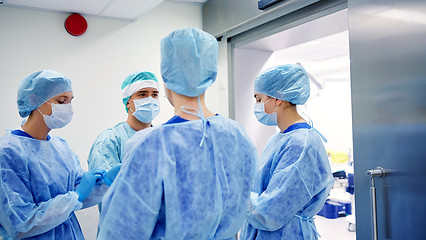 Image showing group of surgeons in operating room at hospital