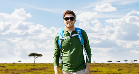 Image showing happy young man with backpack traveling in africa