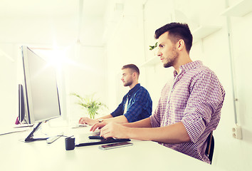 Image showing man or designer with computer and tablet at office