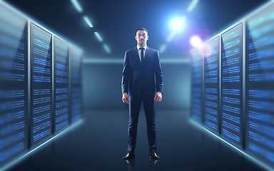 Image showing businessman over server room background