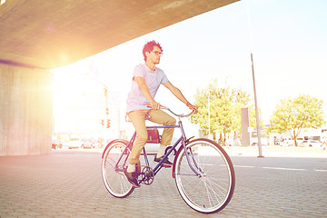 Image showing young hipster man riding fixed gear bike