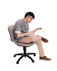 Image showing Asian man working at his laptop.